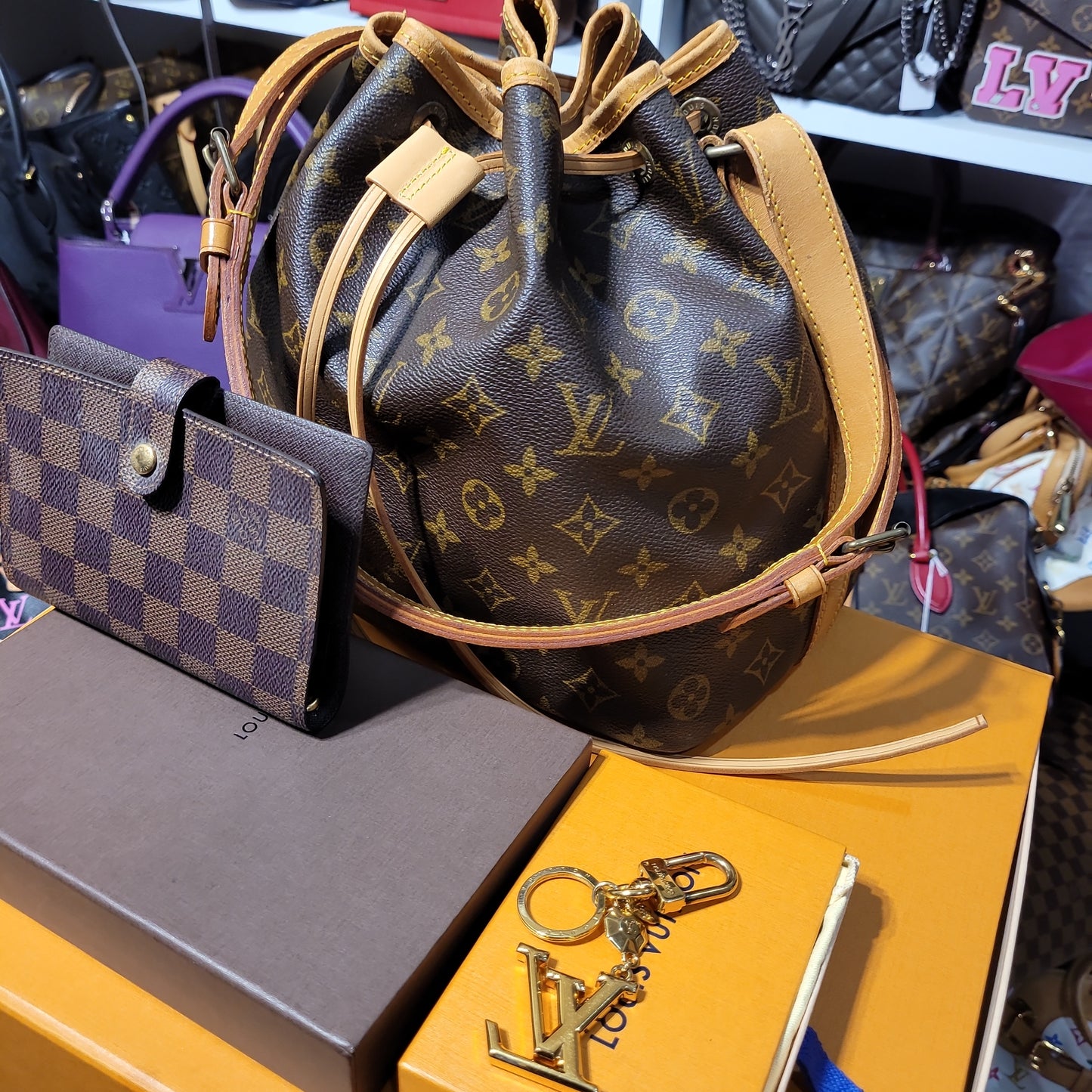 Set of Louis Vuitton bundle of Noe, agenda cover and bag charm