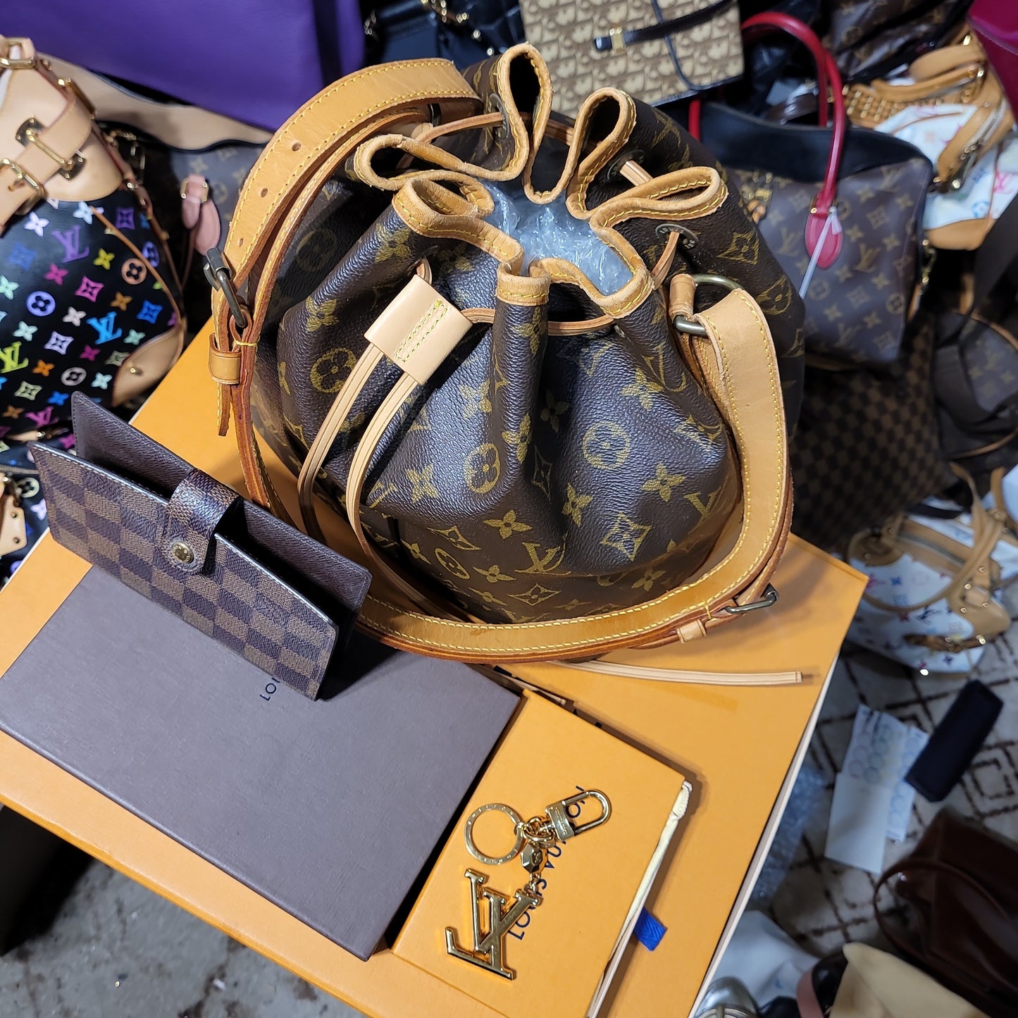 Set of Louis Vuitton bundle of Noe, agenda cover and bag charm